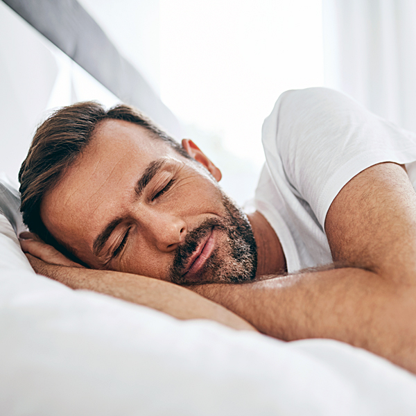 Man enjoying a peaceful sleep on BestSleepGuide.com